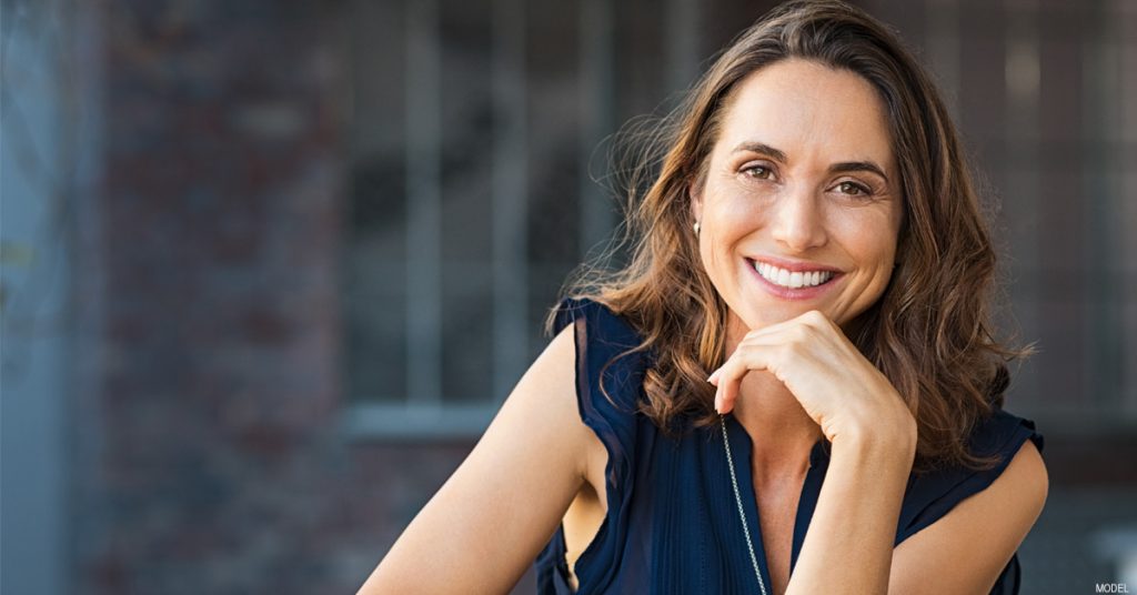 Woman Smiling After Facelift