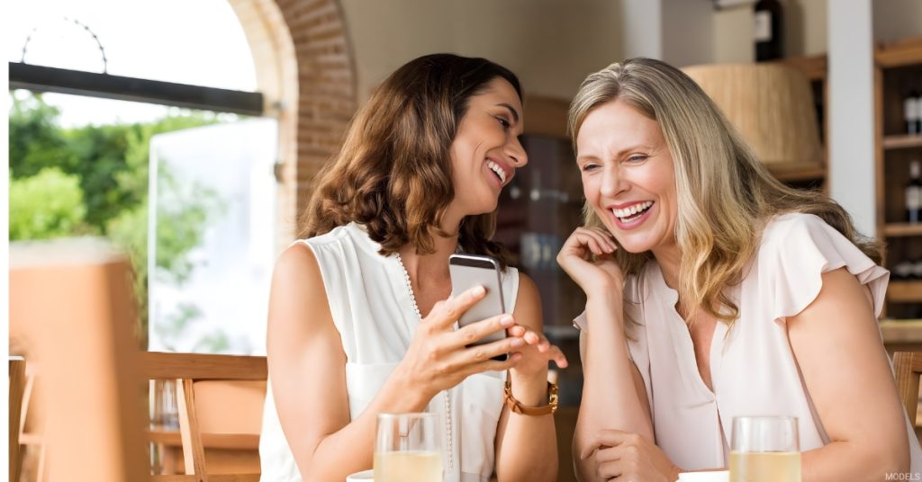 Woman out with her friend after recovering from facelift (models)