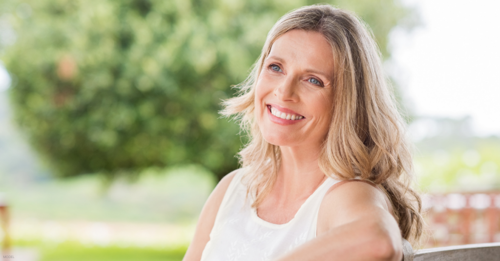 A woman poses for a portrait after getting her facelift procedure completed in Tucson, AZ.